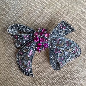 silver brooch with pink beads